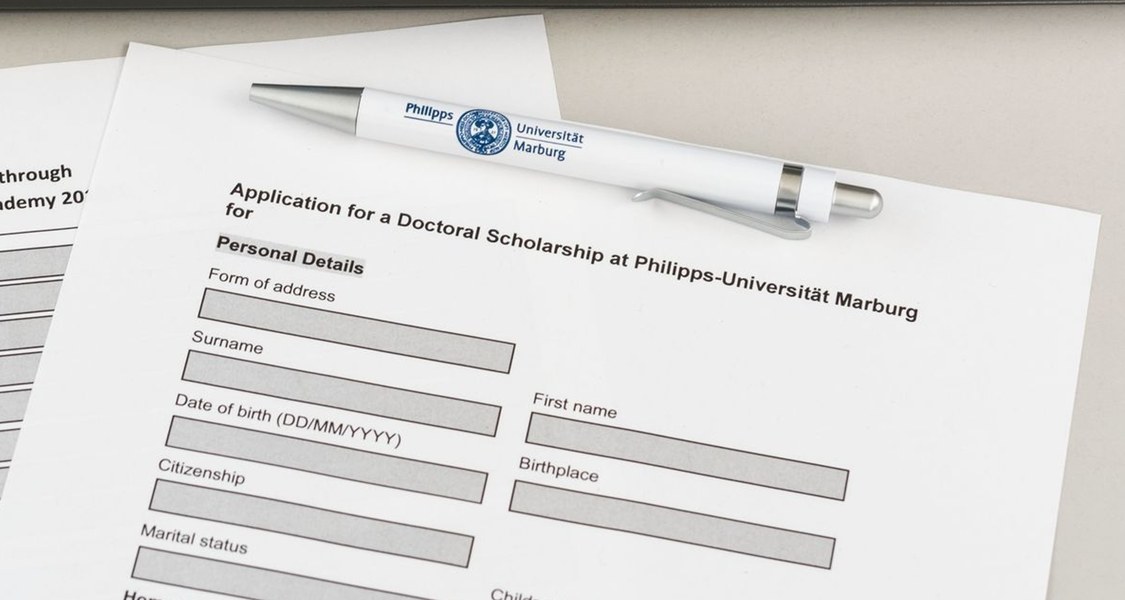 Form for a doctoral scholarship with a ballpoint pen